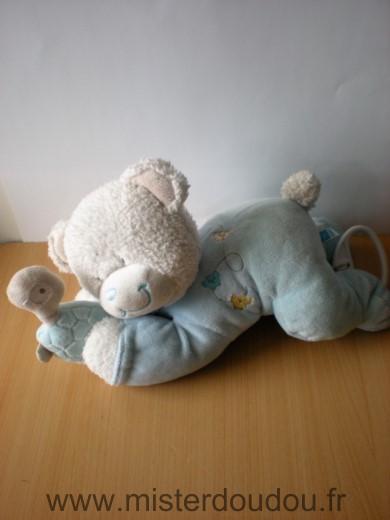 Doudou Ours Tex Allonge bleu avec tortue dan les mains 