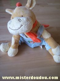 Doudou Cheval Bengy Beige salopette bleue écharpe orange Un trefle et un fer à cheval sont brodés sur la salopette