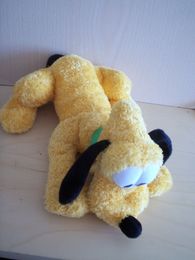 Doudou Chien Disney Jaune collier vert 