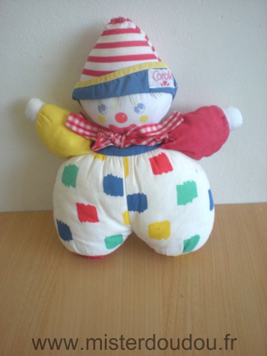 Doudou Clown Corolle Blanc rouge bleu jaune 