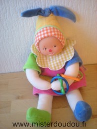 Doudou Clown Corolle Multicolore Anneaux qui coulissent sur les bras, et pieds font bruit de papier.