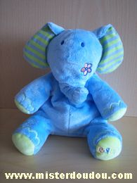 Doudou Eléphant Bruin Bleu oreilles rayées bleu et vert , fleur sur la joue et dans le dos 