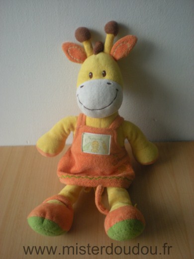 Doudou Girafe Kiabi baby Ma petite tribu, jaune robe orange Écriture à peine visible au stylo sur l étiquette devant (loan) 
petit prix