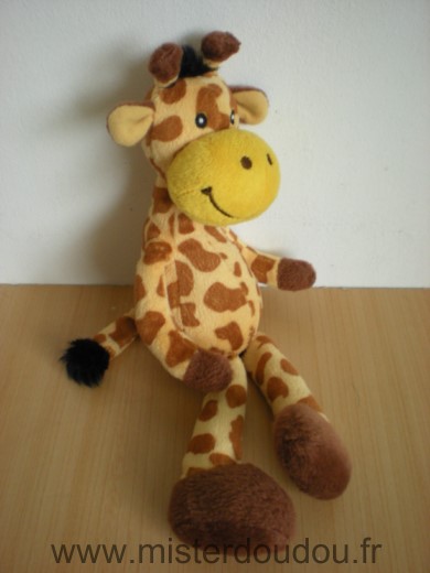Doudou Girafe Mgm Jaune taches marron Etiquette coupee marque supposee mgm