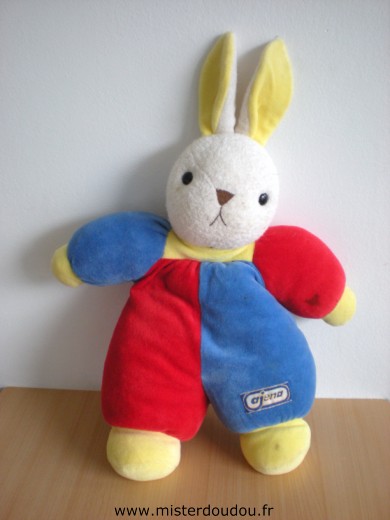 Doudou Lapin Ajena Bleu rouge jaune Tres bon état mais une tache sur son bras