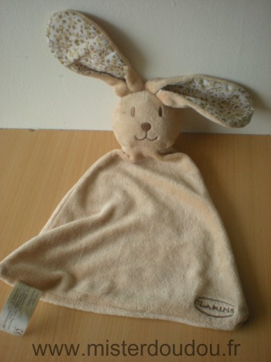 Doudou Lapin Clarins Beige motifs fleuirs dans les oreilles 