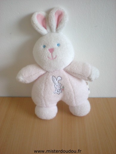 Doudou Lapin Luminou Rose blanc avec un motif lapin sur le ventr 