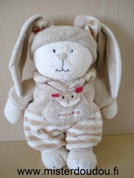 Doudou Lapin Nicotoy Beige rayé marron Assez bon état il manque un ruban rouge à l'oreille