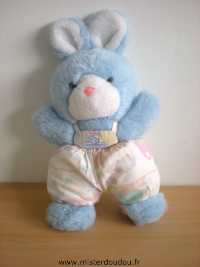 Doudou Lapin Nounours Peluche bleue salopette tissus motifs campagne Tres bon état général mais le dessous d'une patte est abimé