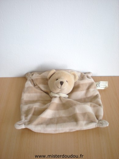 Doudou Ours Cmp Rayé beige écru Un petite tache sur sa tête.