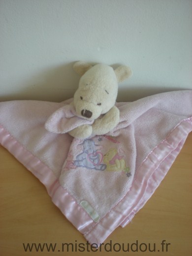 Doudou Ours Disney Winnie couverture rose liseret satin rose motifs winnie efelan porcinet 