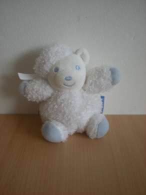 Doudou Ours Kaloo Blanc bleu Ruban d'attache dans le dos