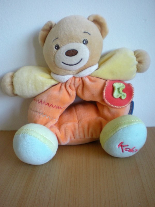 Doudou Ours Kaloo Orange jaune bleu 