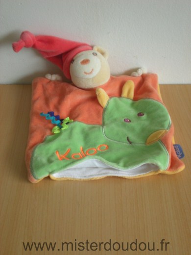 Doudou Ours Kaloo Orange ver bonnet rouge 