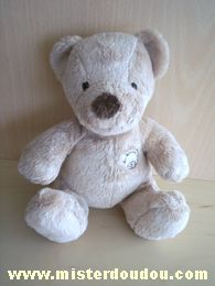 Doudou Ours Nicotoy Beige Avec une tête d'ours brodée sur le ventre