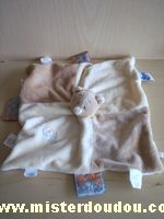 Doudou Ours Noukie s Beige marron pleins d'étiquettes 