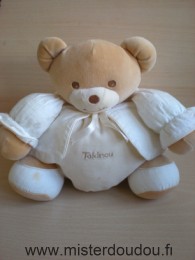 Doudou Ours Takinou Beige gilet ecru Très bon état sauf  une trace sur le pied