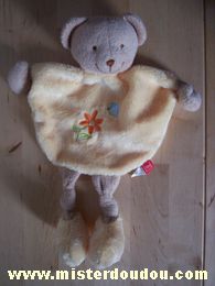 Doudou Ours Tex Jaune Avec une fleur et un papillon brodés sur le ventre