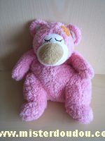 Doudou Ours - marque non connue - Rose Avec une poche dans le dos fermée par fermeture éclaire
