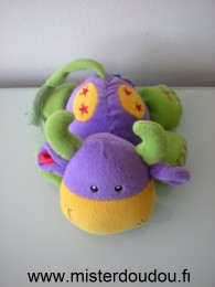 Doudou Vache Imaginarium Violet vert jaune A un pouet pouet dans le ventre